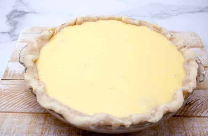 pie with custard filling ready to bake