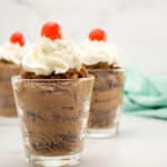 Permalink to: French Chocolate Mousse Recipe - How to Make Chocolate Mousse from Scratch chocolate mousse in three glass dishes with whipped cream and cherry on top