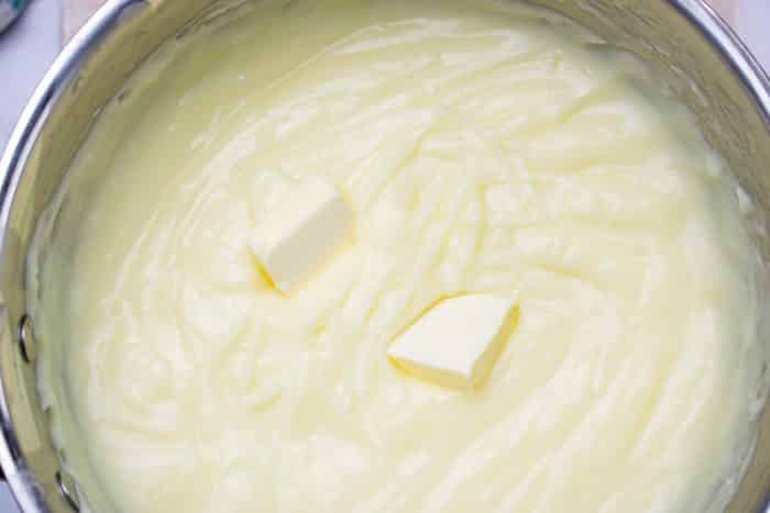 adding butter to custard