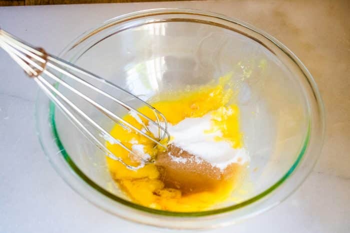 Beat egg yolks and mix with sugar, and vanilla