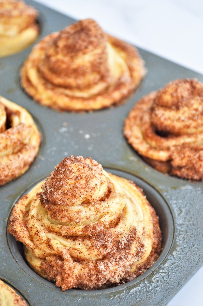 Cinnamon Sugar Cruffins baking in a muffin tin