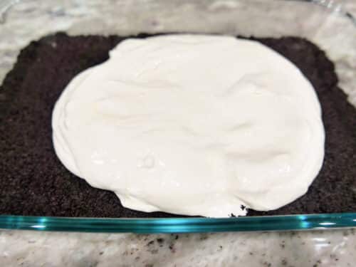 Spread the cream cheese mixture over the cookie crust