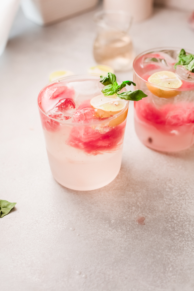 side view of a glass of watermelon drink