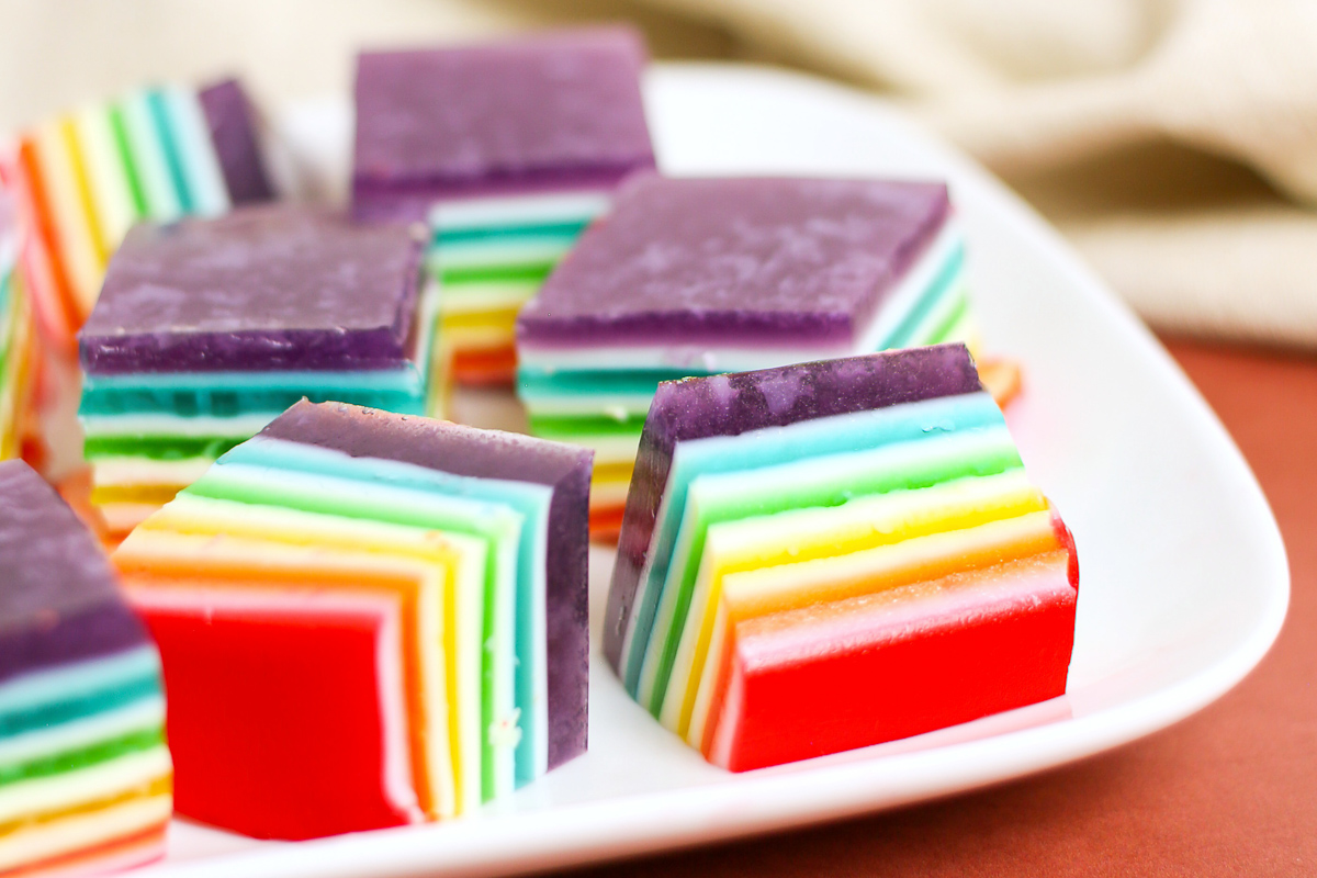 side view rainbow layered jello on plate