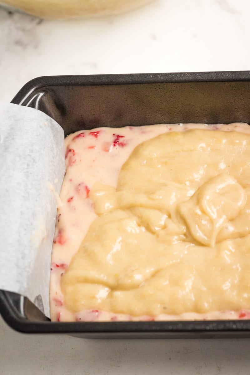 strawberry banana bread batter in pan