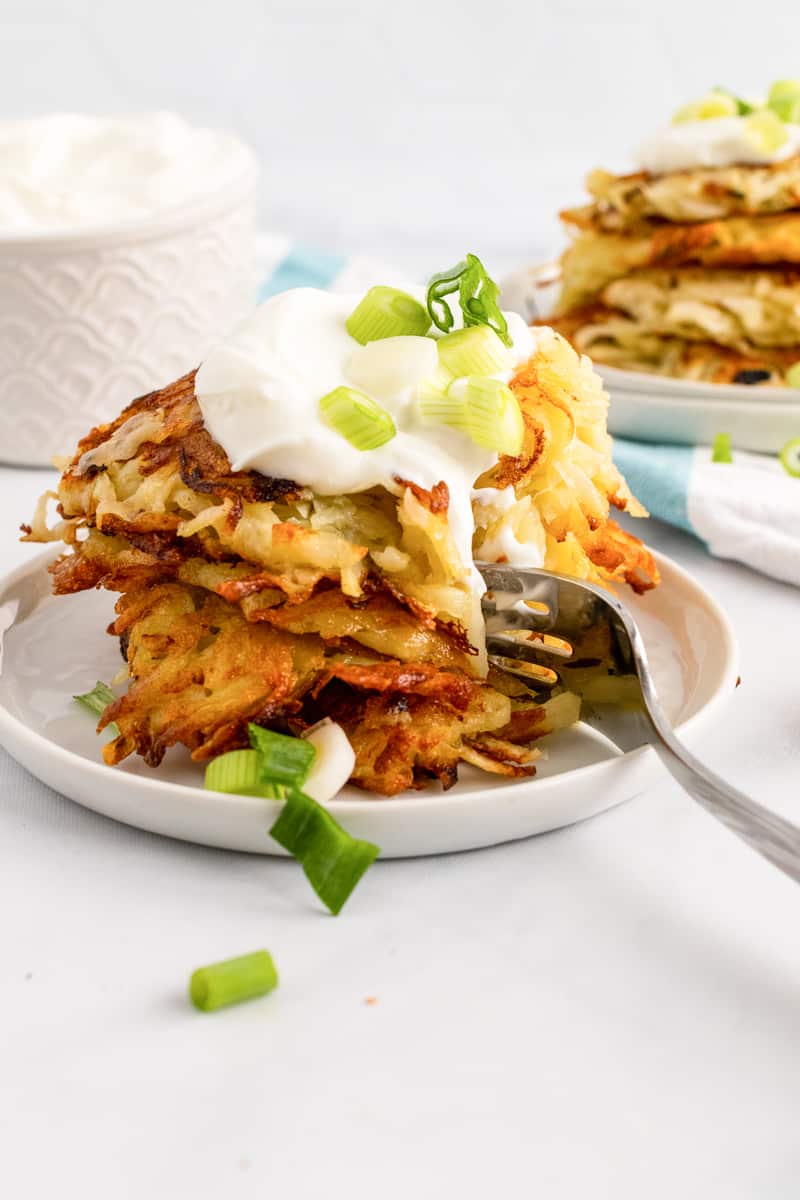 fork in a stack of german potato pancakes