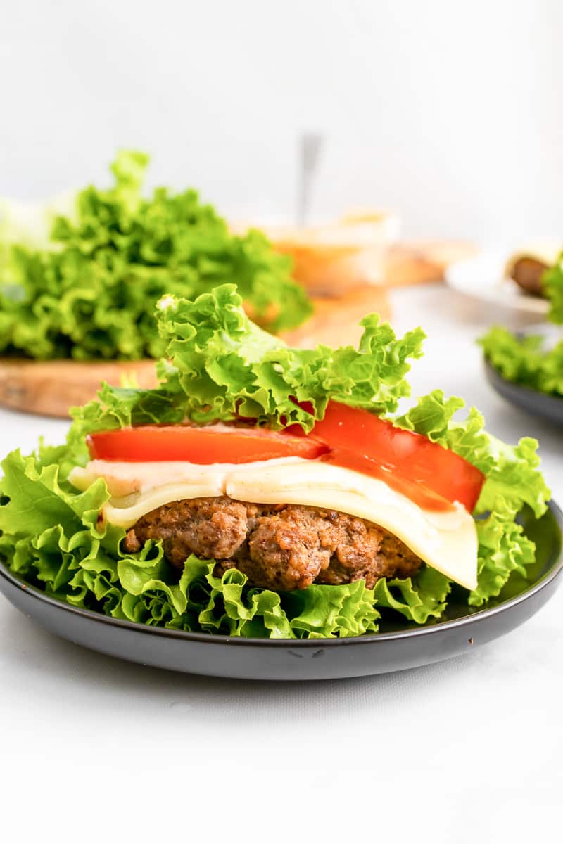 close up assembled lettuce wrap burger on a plate