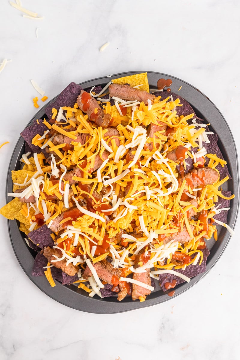 top view of uncooked one-pan fajita nachos