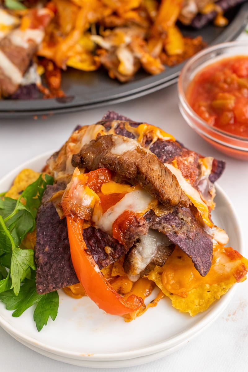 close up of a plate with one serving of one-pan fajita nachos