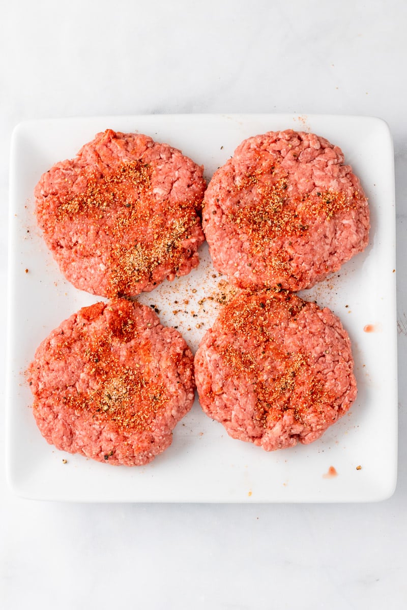 burger patties topped with best burger seasoning