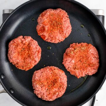 cooking burgers on stove