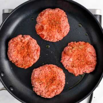 cooking burgers on stove