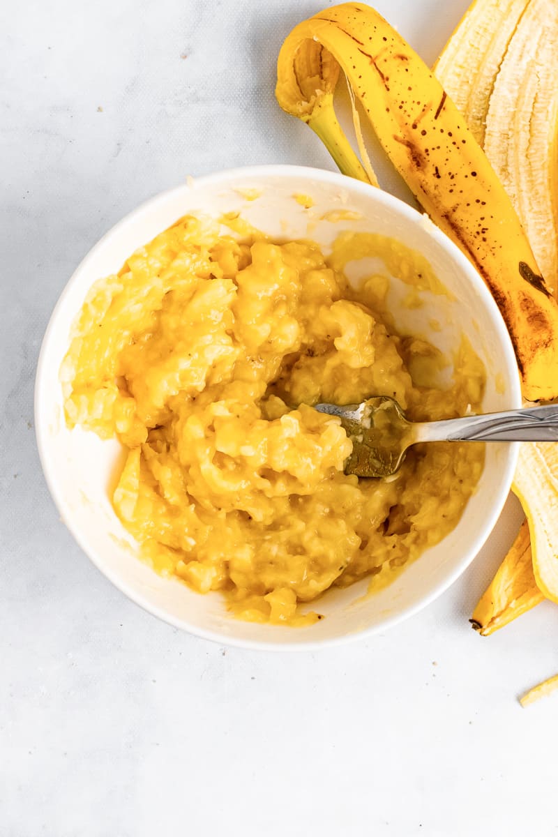 mashed bananas in a bowl for homemade banana pudding