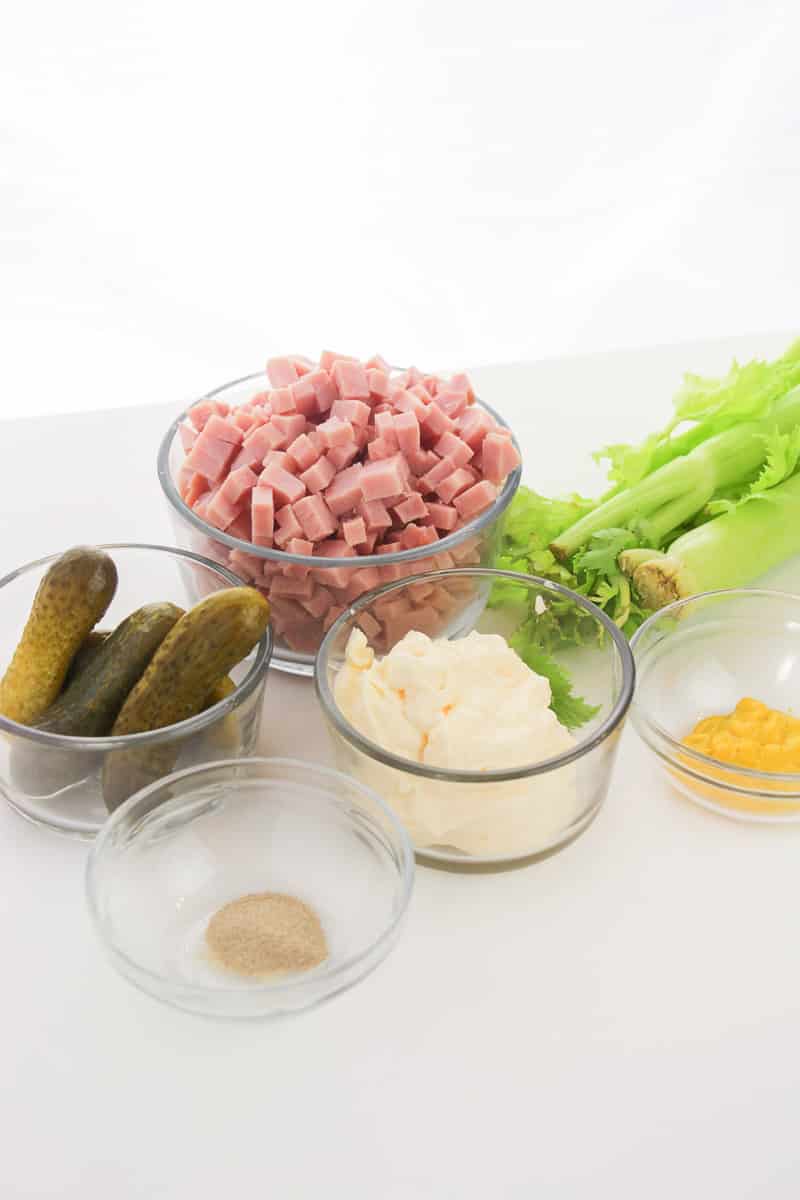 ingredients for old fashioned ham salad in clear bowls