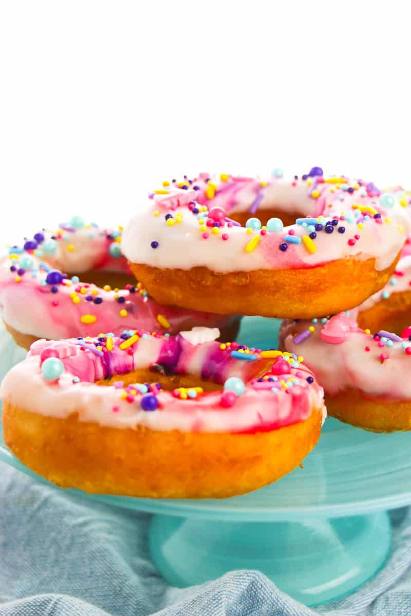 side view of unicorn donuts on blue serving 