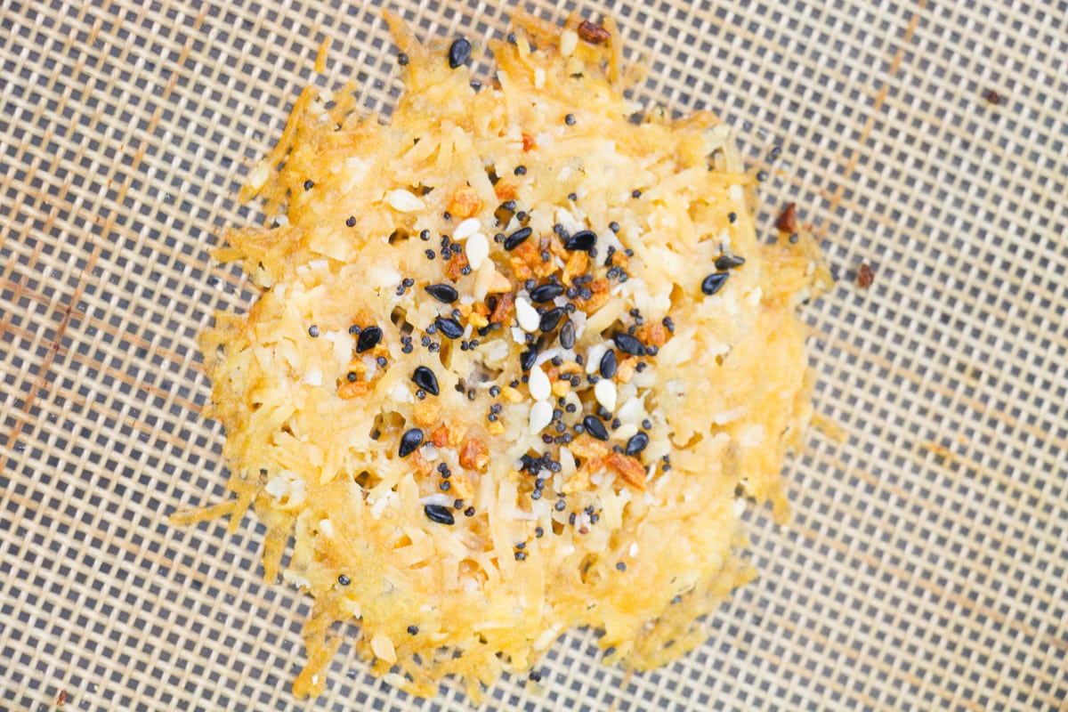 one easy keto cheese crisp on baking mat