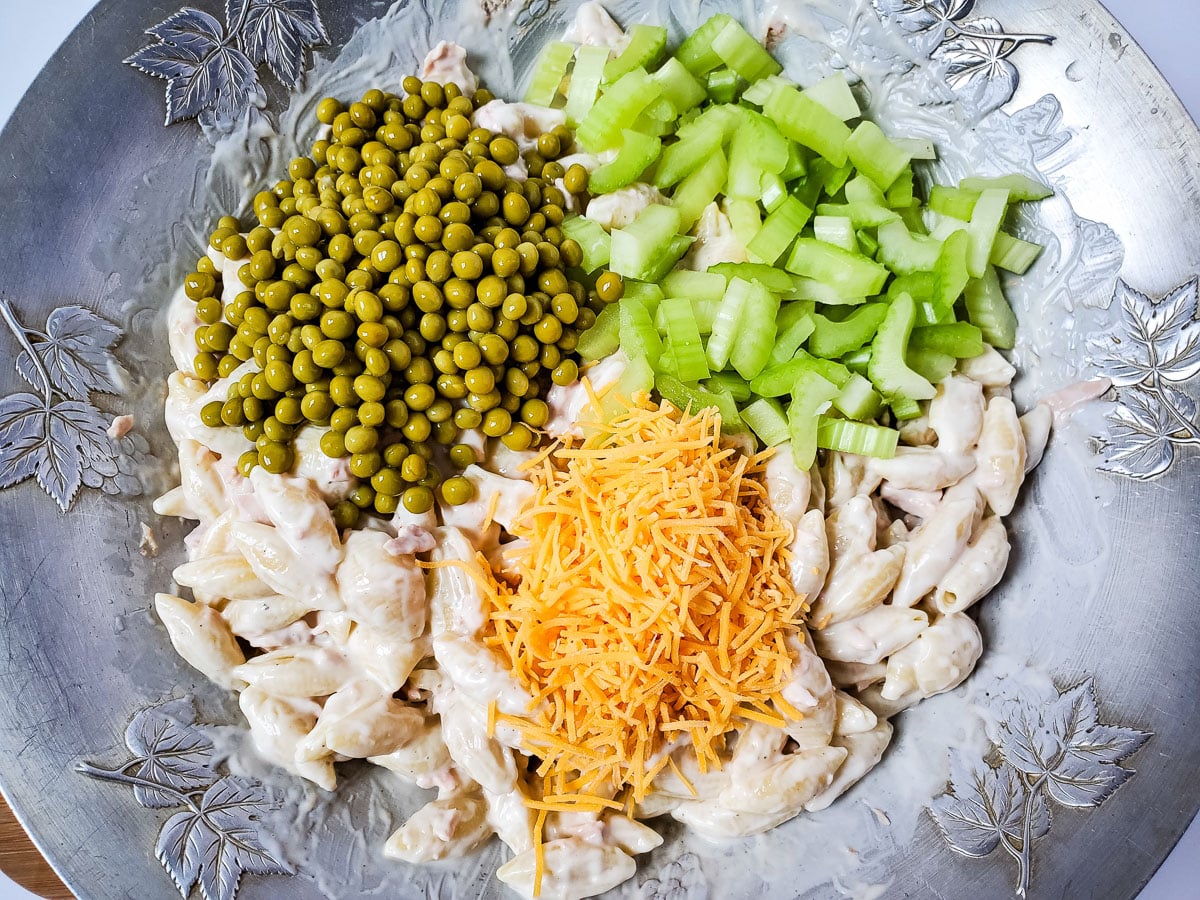 ingredients for creamy tuna egg pasta salad grouped in bowl