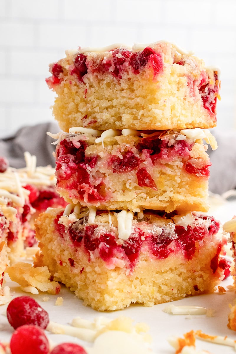 cranberry dessert lemon bars stacked up on a plate