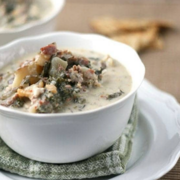 Featured image: bowl of Copycat Zuppa Toscana soup with sausage and kale, All She Cooks