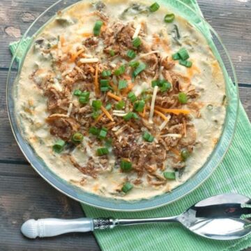 Easy green bean casserole made with frozen green beans, topped with cheddar, french fried onions and green onions