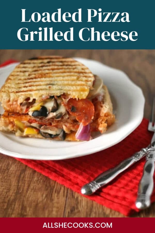 Loaded Pizza Grilled Cheese Pinterest graphic with a pressed sandwich on a plate
