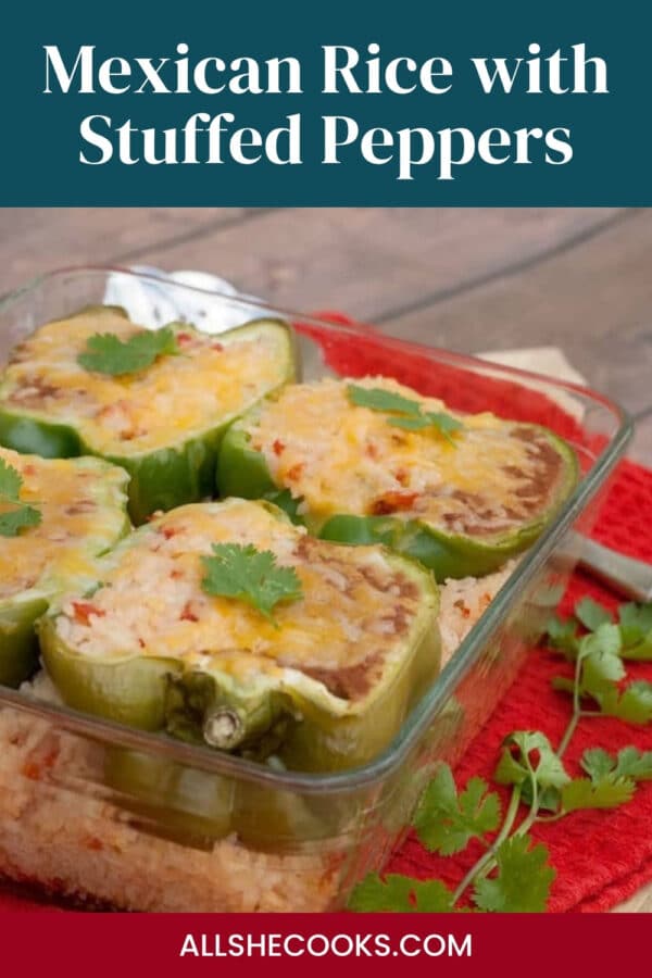 Mexican rice with stuffed peppers baked in a glass dish on a red towel