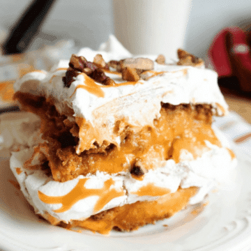 No-bake pumpkin lasagna dessert slice with layers of gingersnaps, pumpkin and whipped cream cheese