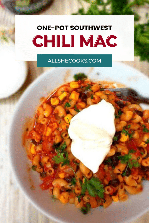 One-Pot Southwest Chili Mac pin with chili mac in a white bowl topped with cilantro and sour cream