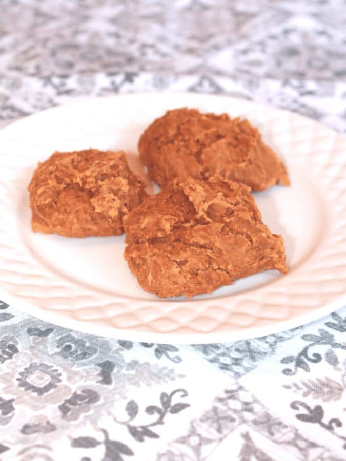 Plate of healthy pumpkin breakfast cookies made with oats, banana and protein powder
