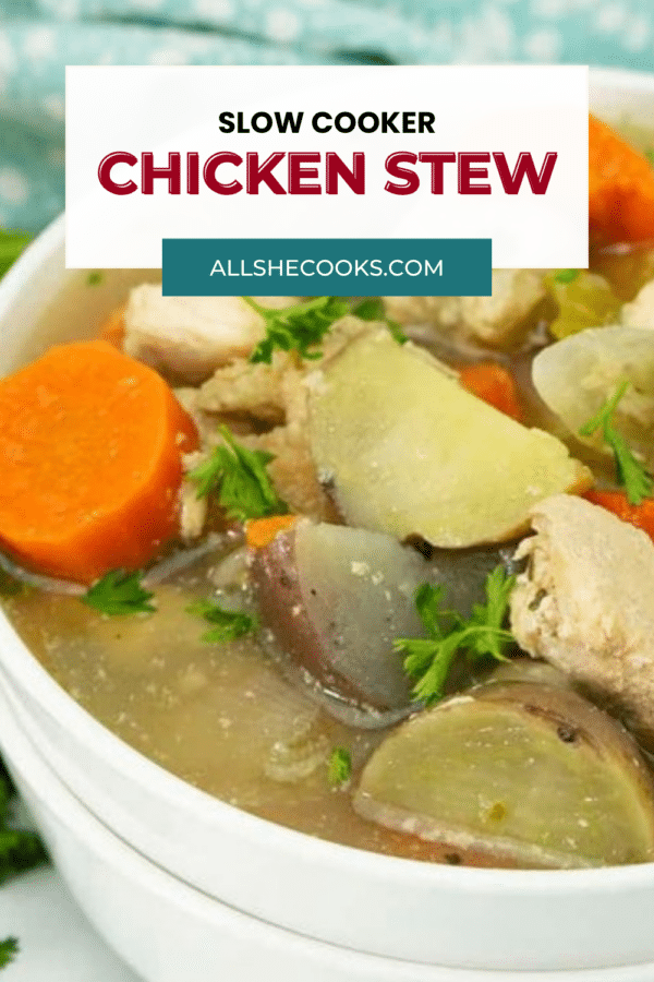 Slow cooker chicken stew close-up with chicken, carrots and potatoes in broth