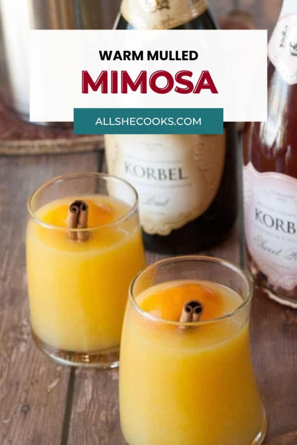 Warm mulled mimosa cocktails with cinnamon sticks for Christmas brunch