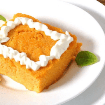 Weight Watchers crustless pumpkin pie slice with whipped topping - All She Cooks featured image