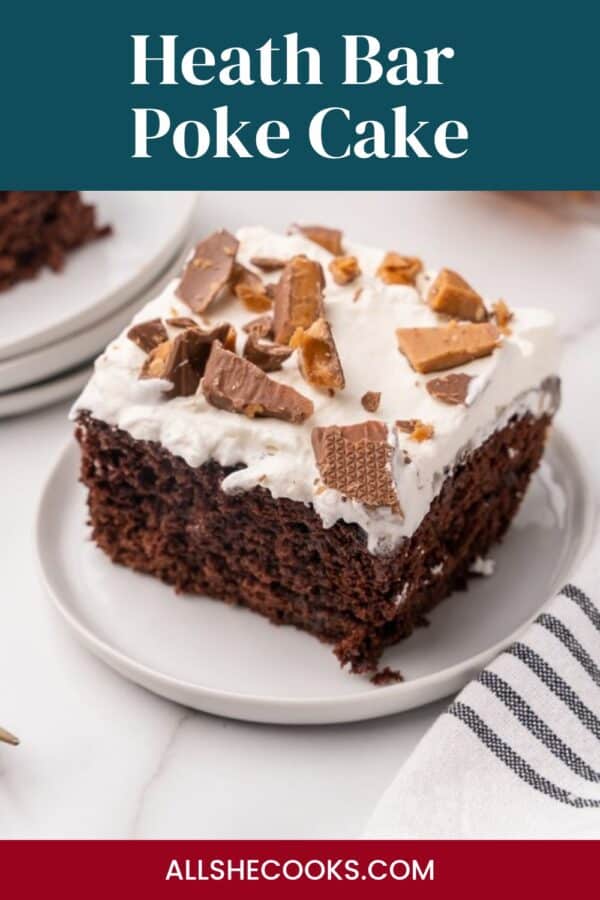Heath Bar Poke Cake slice with whipped cream and toffee pieces