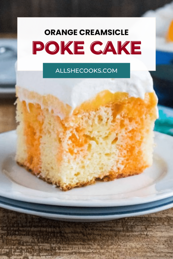 Close-up of an orange creamsicle poke cake slice showing the orange gelatin stripes, with the recipe title